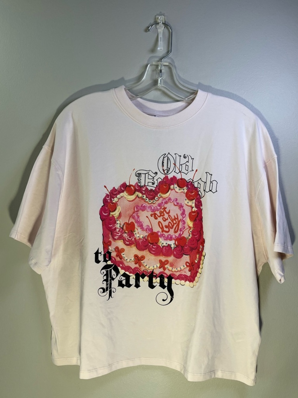 Bershka Oversized Boxy Light Pink “Old Enough to Party” Graphic Tee